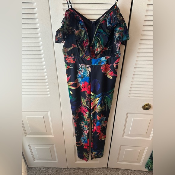 The is a straight leg Jumpsuit - Picture 1 of 2